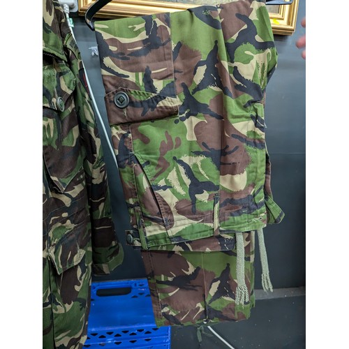 1035 - Four camouflage jackets and matching trousers