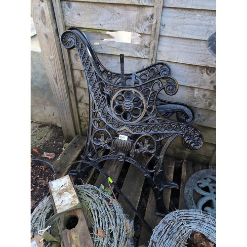 540 - Pair of cast iron bench ends.