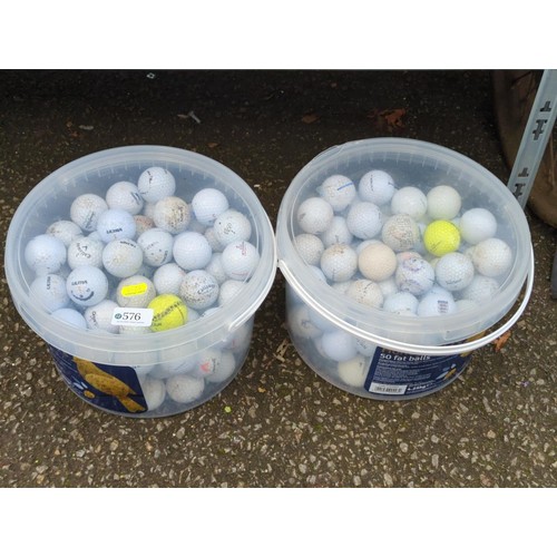 576 - 2 tubs of used golf balls.