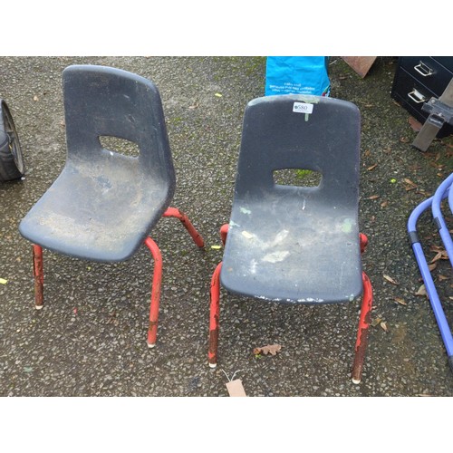 580 - 2 infant-sized school chairs in distressed condition.