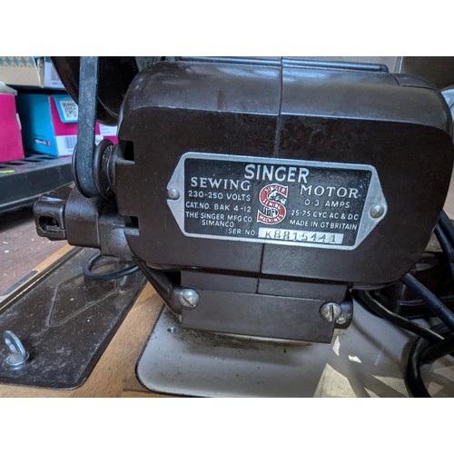 240 - Singer electric sewing machine in case with pedal.