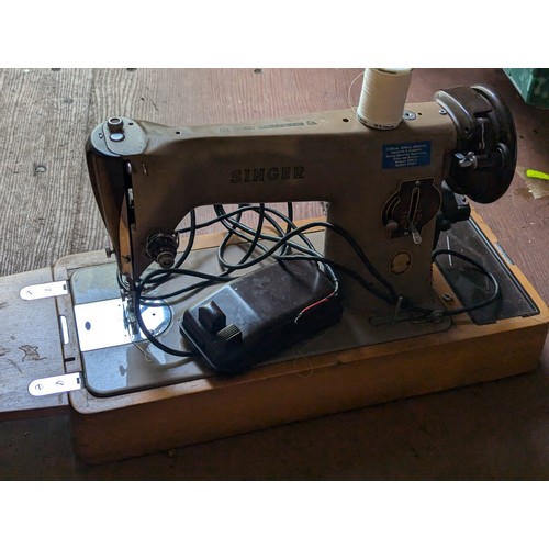 240 - Singer electric sewing machine in case with pedal.