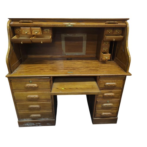 21 - Large bureau with tambour front. W138cm D72cm H135cm.