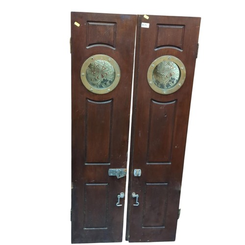 29 - Pair of narrow doors (possibly from a boat) with porthole windows. W32cm H137cm. 