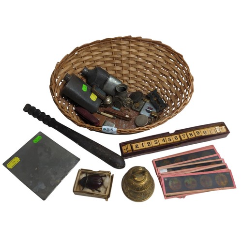 398 - Basket of assorted collectables, including two hip flask, brass bell, HM silver banded cheroot, slid... 