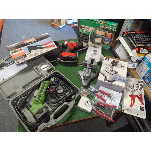 108 - Selection of tools inc parkside stapler, swivel vice, electric saw in case., riveter, drill.