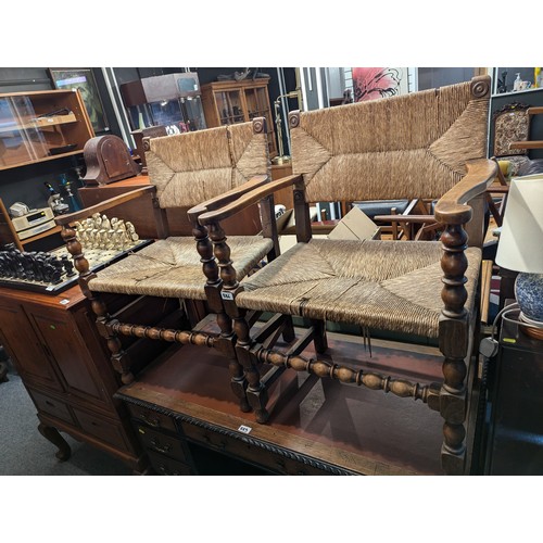 886 - Pair of turned oak rush backed and seated armchairs