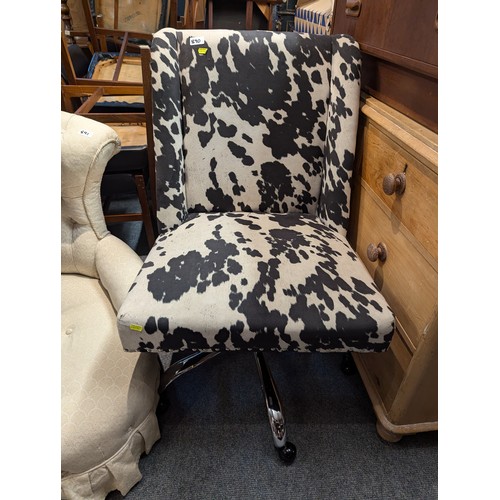 890 - Wide cow hide style swivel chair