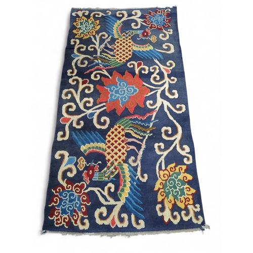 897 - Birds of paradise rug in blues and red, 91 x 182cm