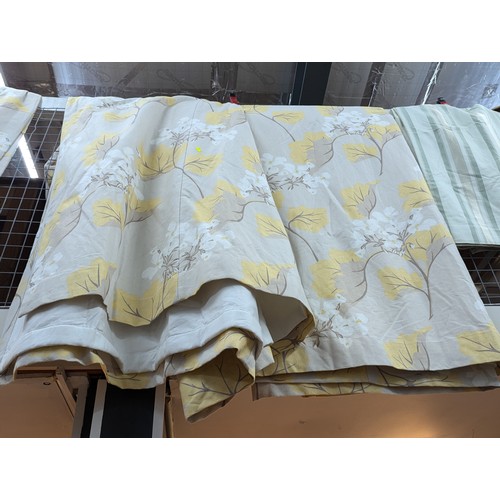 899 - Pair of Laura Ashley curtains depicting flora in shades of yellow and white,  each curtain with... 