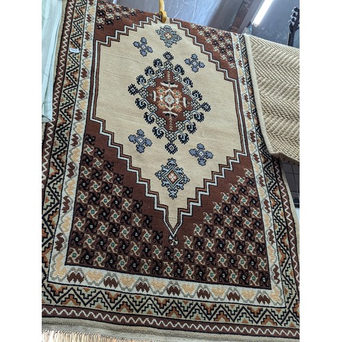 902 - Brown and cream with central medallion rug, 100 x 200cm