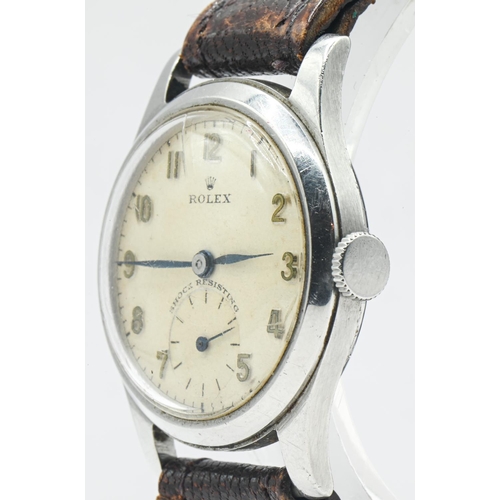 11 - Rolex Shock Resisting stainless steel cased watch, circa 1940s, the signed champagne dial with appli... 