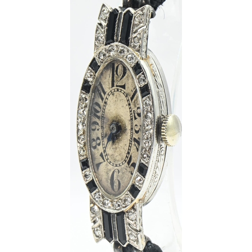 13 - Art Deco ladies platinum, diamond and onyx cased watch, the silvered dial with Arabic numerals, the ... 