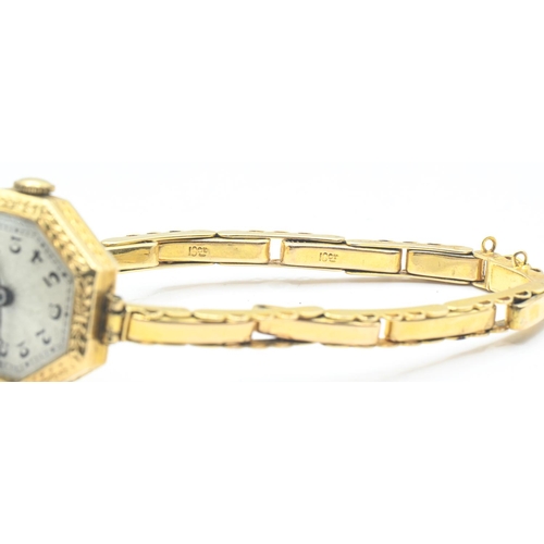 21 - Art Deco 18ct gold cased ladies wristwatch, with laurel leaf decorated octagonal-shaped case, the en... 