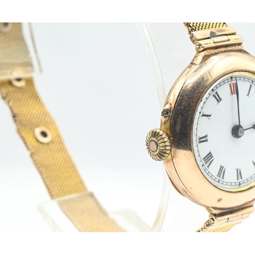 25 - 9ct gold cased ladies wristwatch, the white enamel dial with Roman numerals, movement signed 'D... 