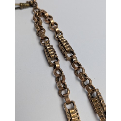 41 - Yellow metal bar and link Albert chain with T-bar marked 9c (chain end clasp missing) with a central... 