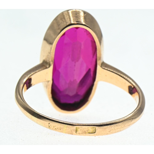 45 - Yellow metal mounted oval-shaped synthetic ruby ring, faint marks to back of shank, tests positive f... 