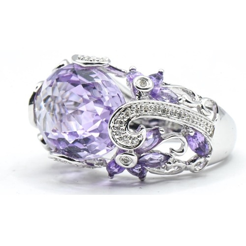 56 - Impressive 14ct white gold, amethyst and diamond cocktail ring, stamped 14K and with Birmingham hall... 