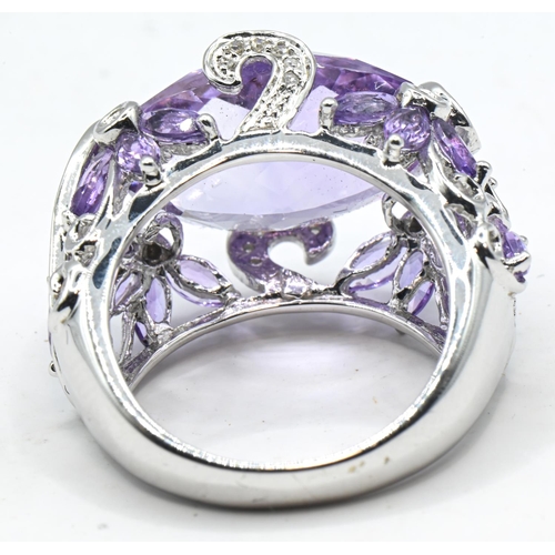 56 - Impressive 14ct white gold, amethyst and diamond cocktail ring, stamped 14K and with Birmingham hall... 