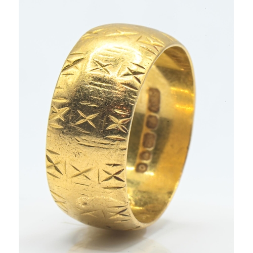 67 - 22ct gold band ring, continuously decorated with an X motif, hallmarked London 1969, size N, 8.5 gra... 