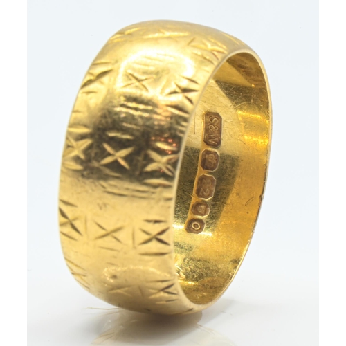 67 - 22ct gold band ring, continuously decorated with an X motif, hallmarked London 1969, size N, 8.5 gra... 