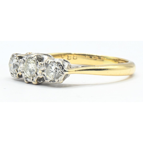 77 - Yellow metal mounted three diamond ring, the diamonds together weighing approximately 0.44 carat, ye... 