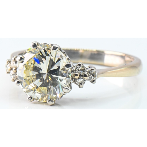 78 - 18ct gold and diamond ring, centring a brilliant-cut diamond weighing approximately 2.50 carats flan... 