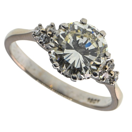 78 - 18ct gold and diamond ring, centring a brilliant-cut diamond weighing approximately 2.50 carats flan... 