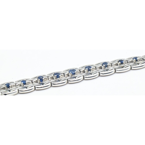 81 - 14ct white gold and sapphire bracelet, stamped 585, length 190mm, gross weight 18.83 grams