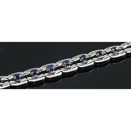 81 - 14ct white gold and sapphire bracelet, stamped 585, length 190mm, gross weight 18.83 grams