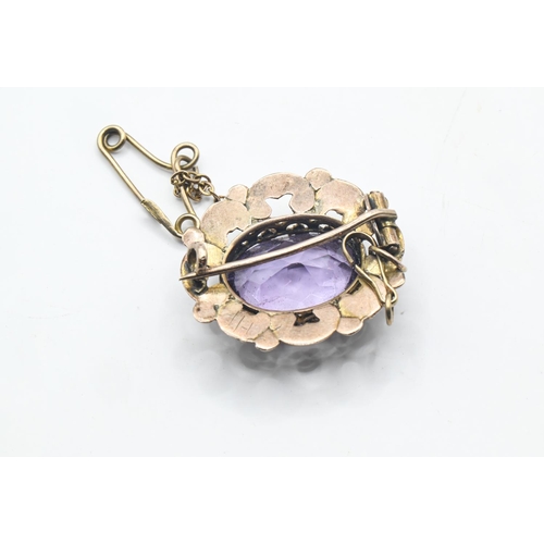 85 - Yellow metal and amethyst brooch, yellow metal tests positive for 9ct gold, width 20mm, gross weight... 