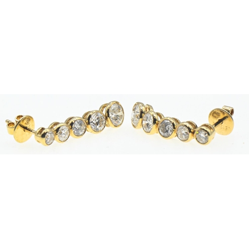 96 - Pair of 18ct gold and diamond drop earrings, designed as a graduated drop of five collet-set brillia... 