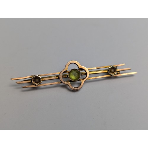 119 - Three 9ct gold bar brooches, one set with green paste and seed pearls, and another with seed pearls ... 