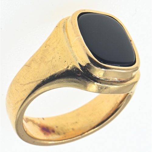 130 - Yellow metal mounted black onyx signet ring, tests positive for 18ct gold, size P1/2, gross weight 1... 