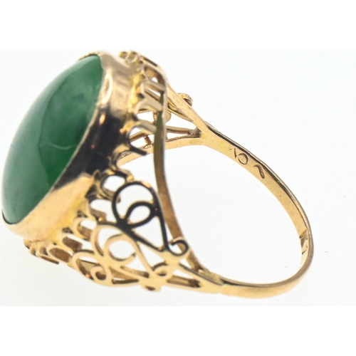 135 - Yellow metal and nephrite jade ring, tested as 18ct gold, indistinct marks to shank, size O1/2, gros... 