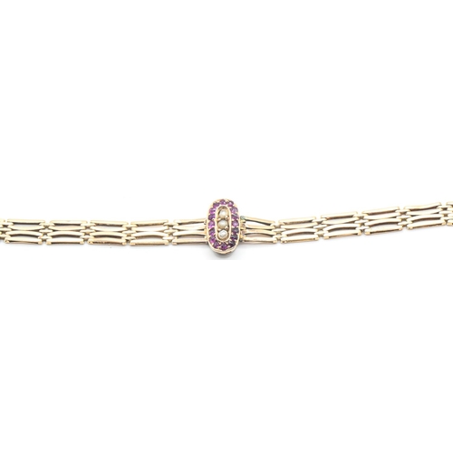 188 - 9ct gold gate link bracelet with central pink stone and seed pearl cluster, stamped 9.375, length 17... 