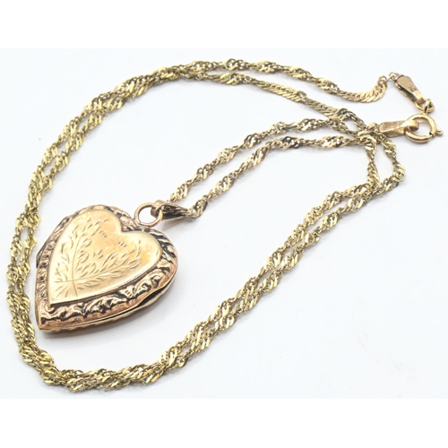 193 - 9ct gold back and front heart-shaped locket and a 9ct gold Singapore link chain, locket stamped 9CT ... 