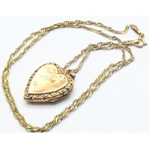 193 - 9ct gold back and front heart-shaped locket and a 9ct gold Singapore link chain, locket stamped 9CT ... 