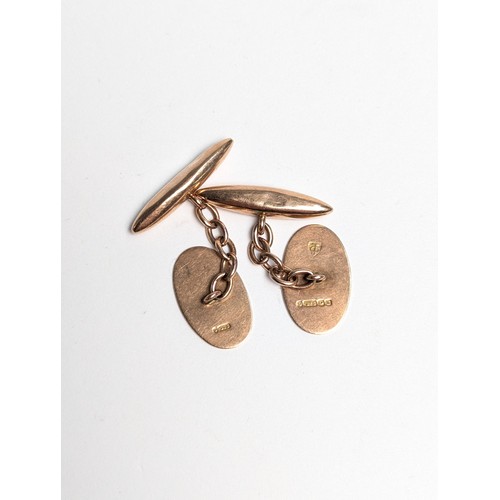 229 - Pair of 9ct rose gold cufflinks, each with one oval plaque with engine-turned decoration, plaques me... 