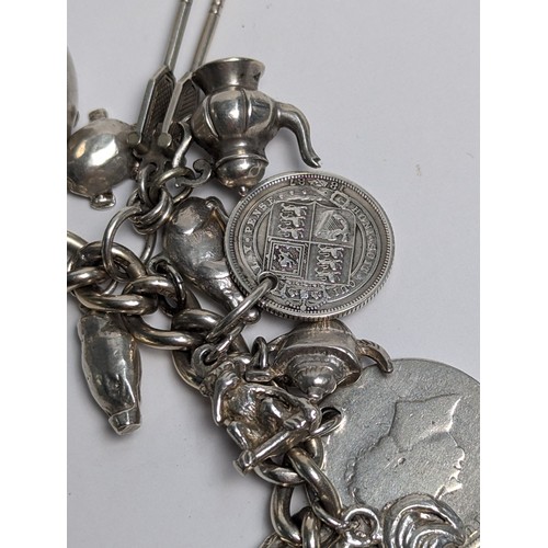 285 - Silver charm bracelet with heart-shaped padlock clasp and silver and white metal charms, gross weigh... 