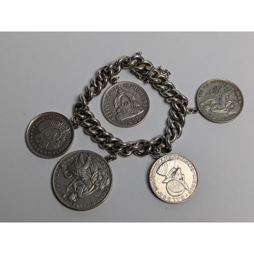 290 - 900 grade Chilean silver curb link bracelet suspending five South American silver coins, including t... 