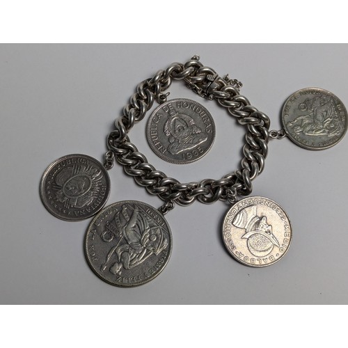 290 - 900 grade Chilean silver curb link bracelet suspending five South American silver coins, including t... 