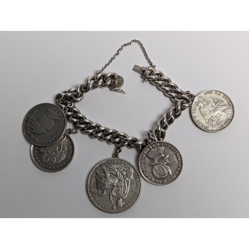 290 - 900 grade Chilean silver curb link bracelet suspending five South American silver coins, including t... 