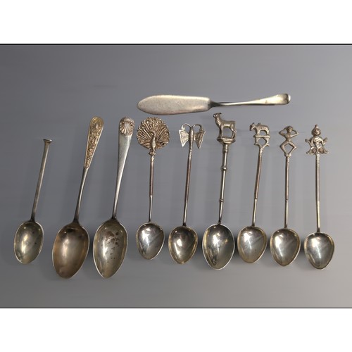 353 - Four assorted silver spoons and butter knife, various makers and dates, silver gross weight 70 grams... 