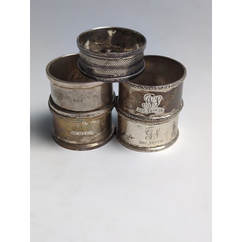 370 - Five silver napkin rings, various makers and dates, including a pair with dated initials, gross weig... 