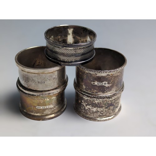 370 - Five silver napkin rings, various makers and dates, including a pair with dated initials, gross weig... 