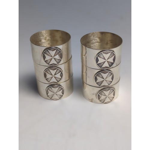 373 - Cased set of six Maltese silver napkin rings, each polished ring with an applied Maltese cross, with... 