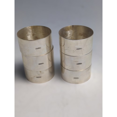 373 - Cased set of six Maltese silver napkin rings, each polished ring with an applied Maltese cross, with... 