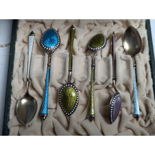 377 - Cased set of six Norwegian silver gilt and enamel demi-tasse spoons, each with six varied coloured e... 