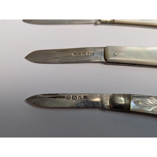 384 - Four silver and mother-of-pearl fruit knives, various 19th and 20th century hallmarks